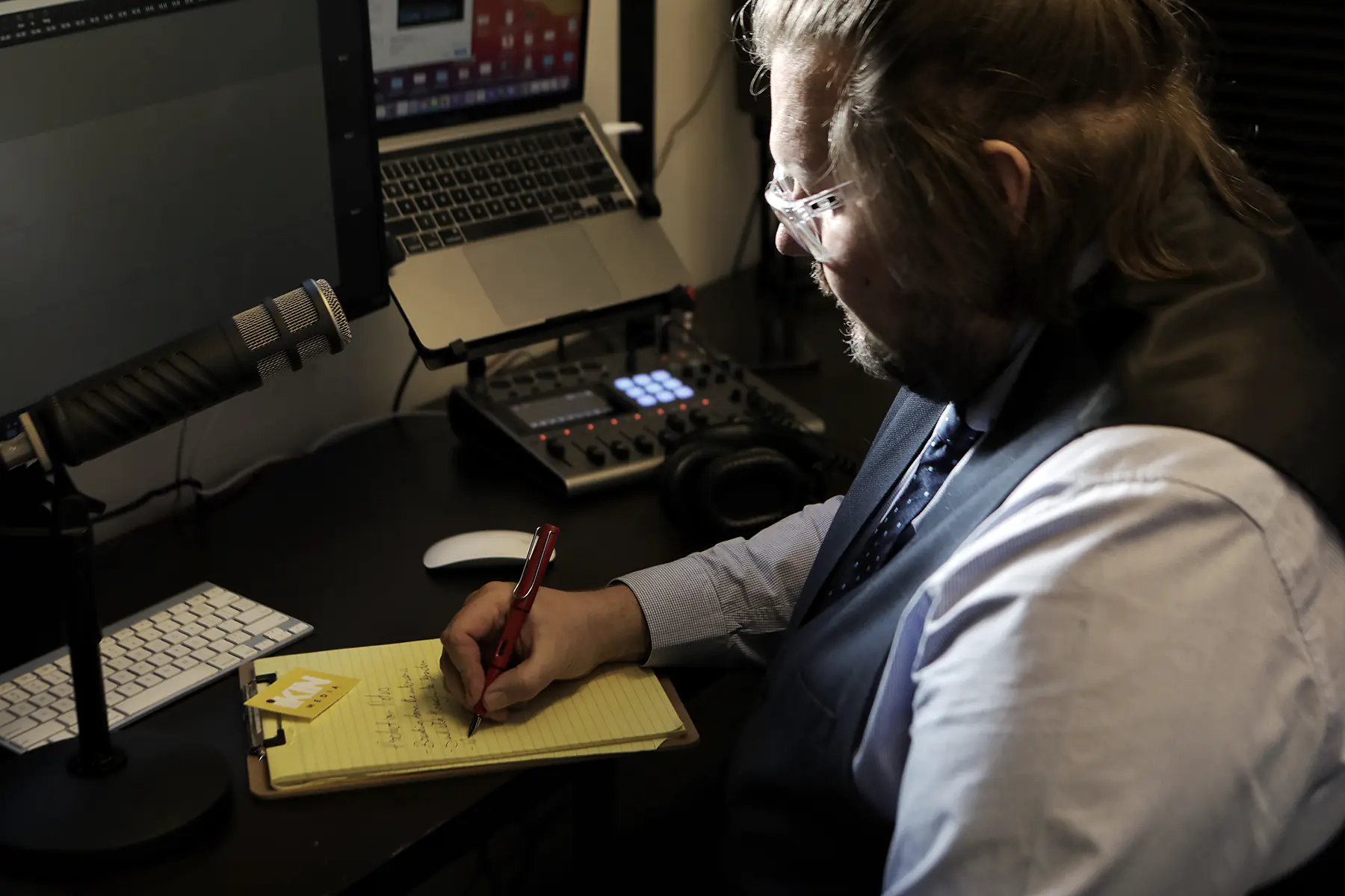 Sam Ikin in the recording studio writing production notes. Photo: Paul’s Studio and Photography.